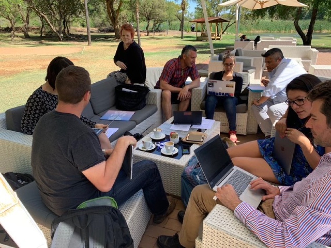 Members of the Global Indigenous Data Alliance meet outdoors in Gaborone, Botswana in 2018.