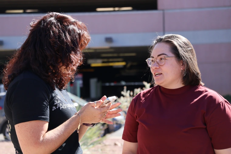 Gail Brennan and Tamara Murdock converse at NNI in Tucson.