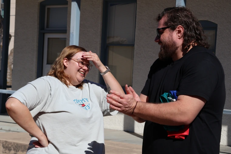 Hope Kuchel shields her eyes from the sun as she converses with Aurora Study Tour Leader Mark Mackay