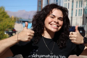 Australian Indigenous lawyer Gail Brennan gives two thumbs up and smiles while visiting Tucson.