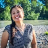 RaeAnna Rabang smiles in front of a river.